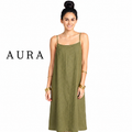 A woman modeling an olive green spaghetti-strap maxi dress against a white background, with the brand name AURA printed in black on the left side.