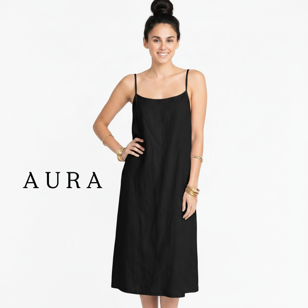 A woman modeling a light gray spaghetti-strap midi dress against a plain white background, with the brand name AURA printed in black on the left side.