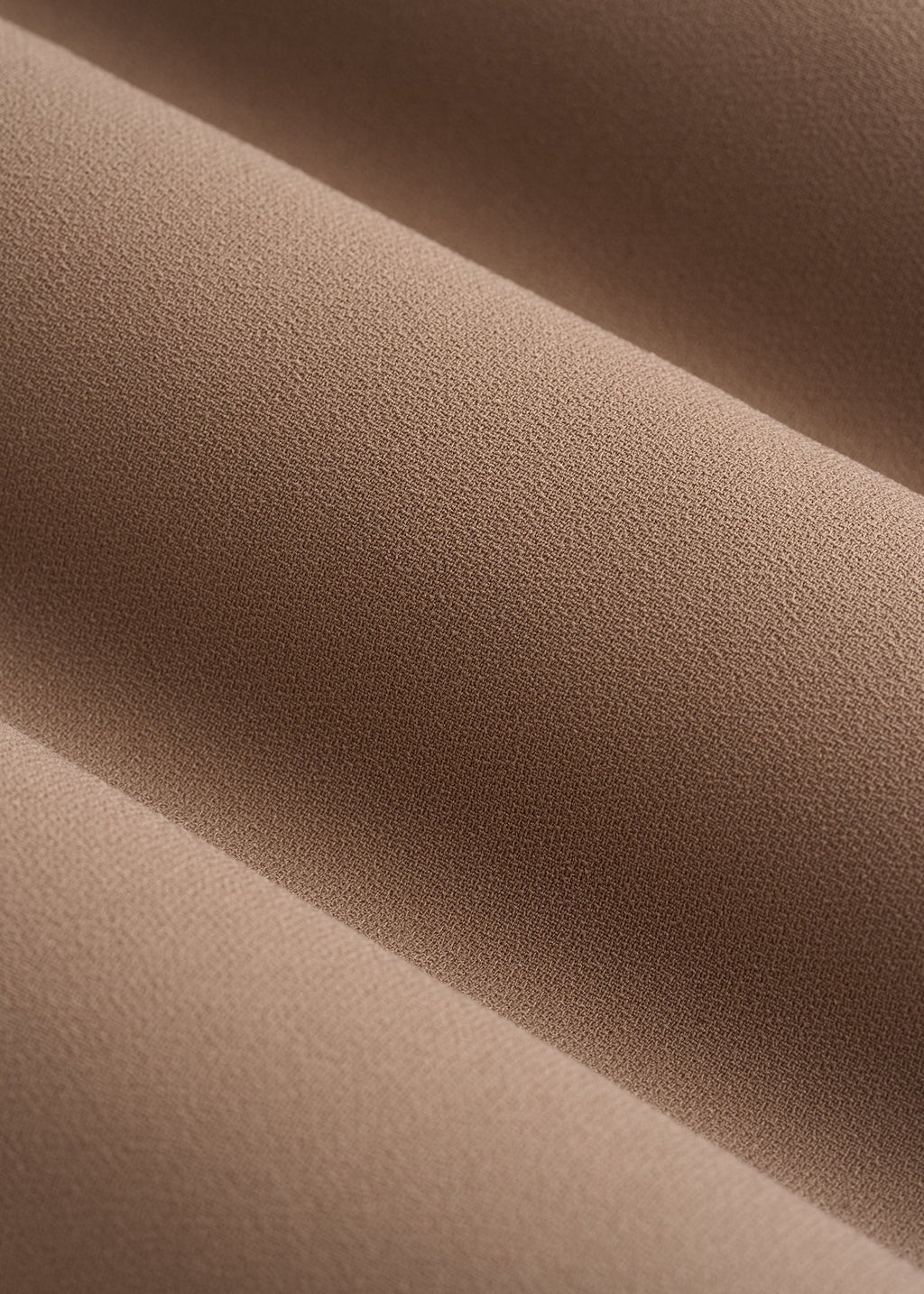 Close-up of brown fabric with visible texture
