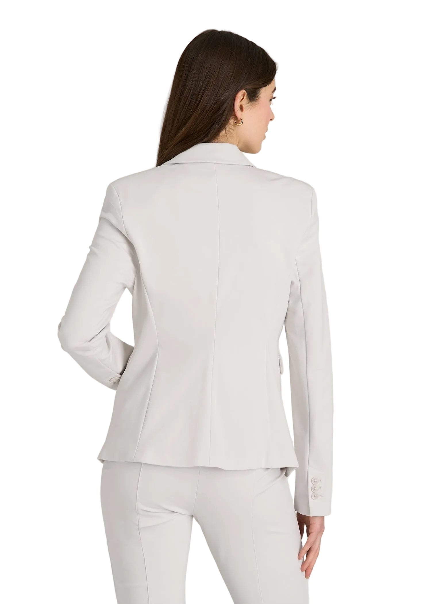 Woman wearing a light gray suit on a white background
