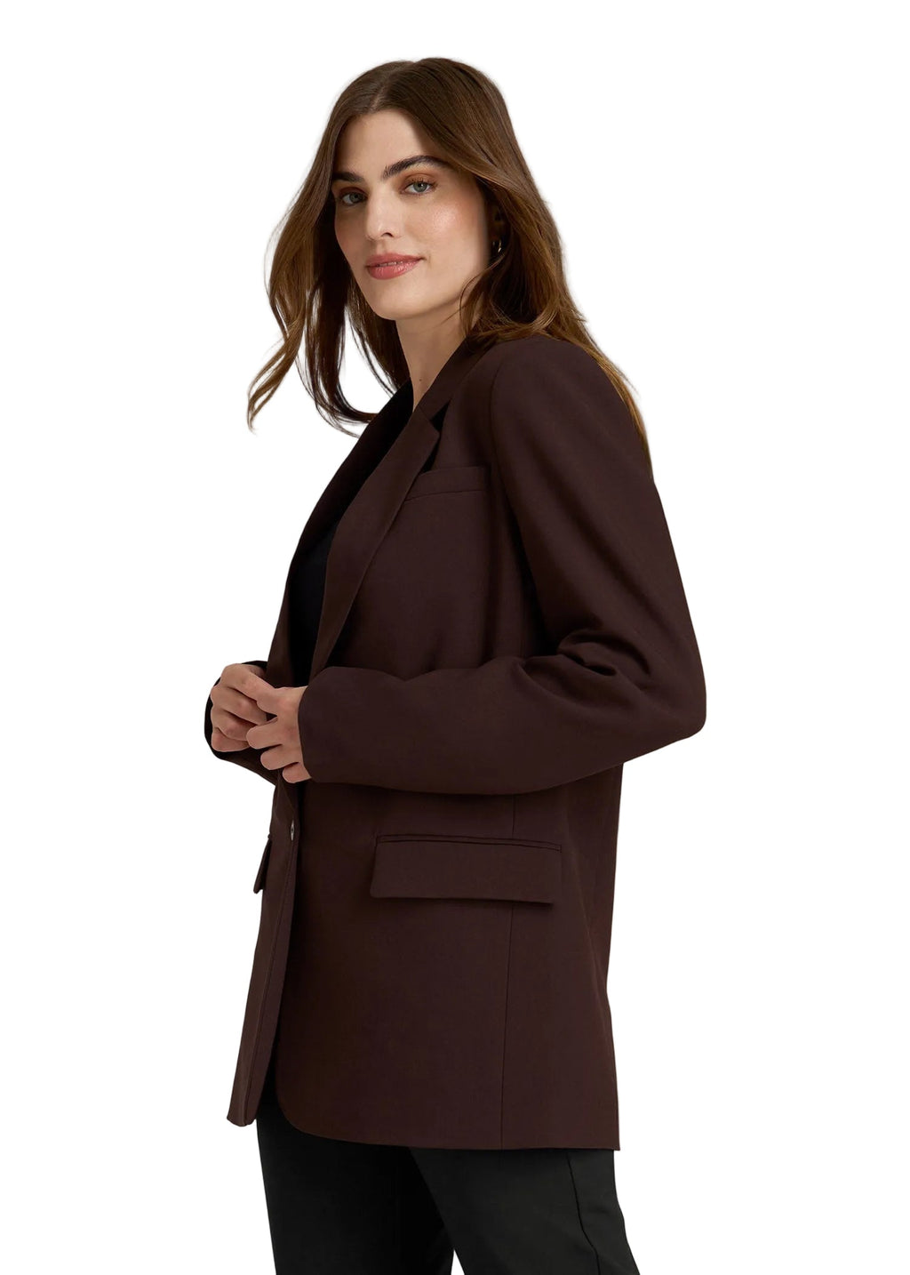 Woman wearing a brown blazer against a plain background