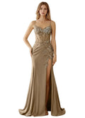 Woman wearing a beige evening gown with intricate detailing on a white background