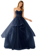 Navy blue strapless gown with floral embellishments on a white background